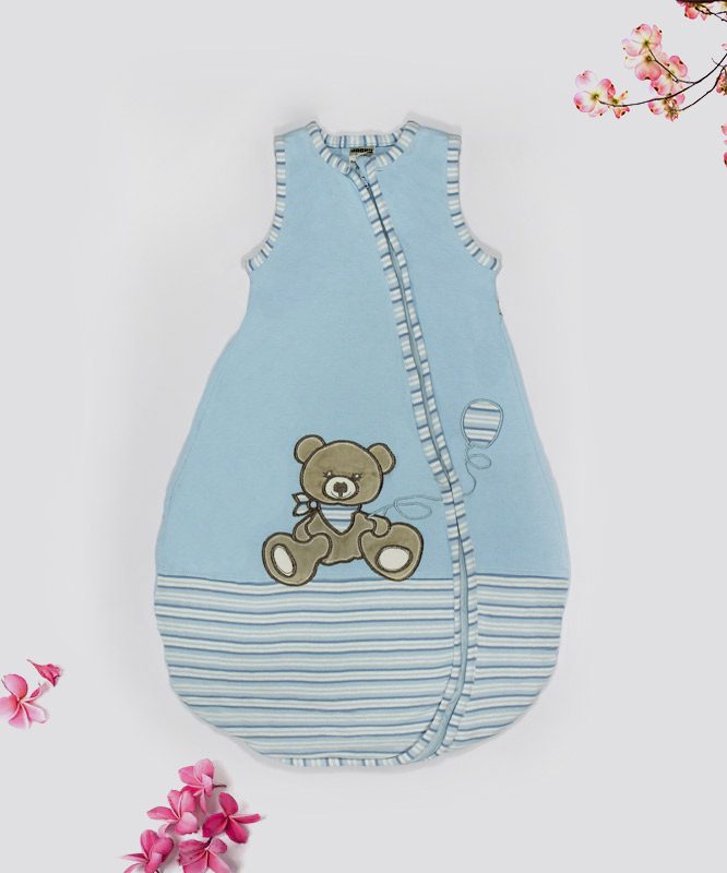 teddy-bear-on-blue-baby-bed-featured